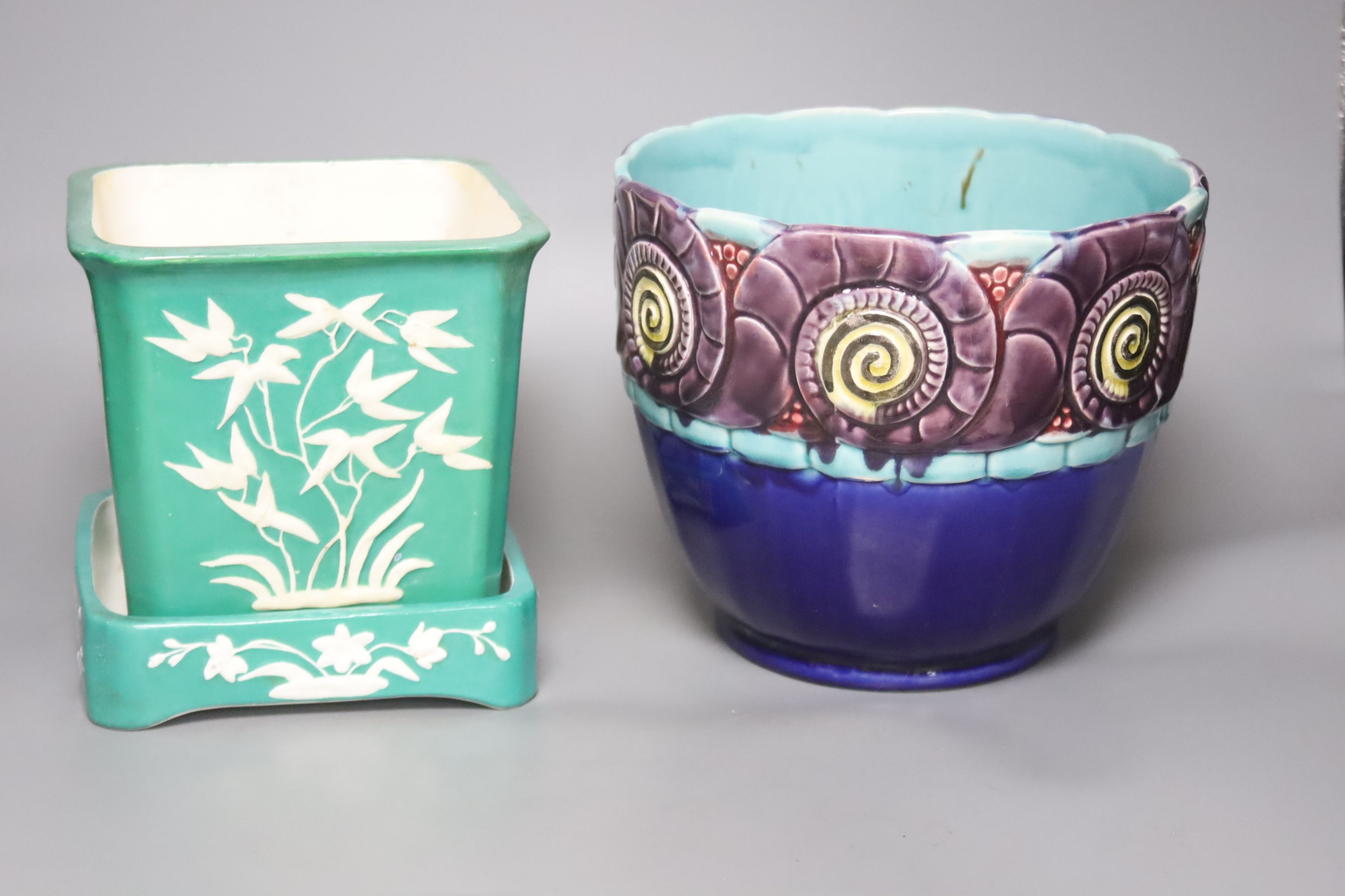 An Orchies majolica jardiniere and a Minton green glazed flower pot and stand